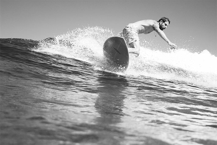 surf guide felippe dal pierro in the maldives wearing riz boardshorts