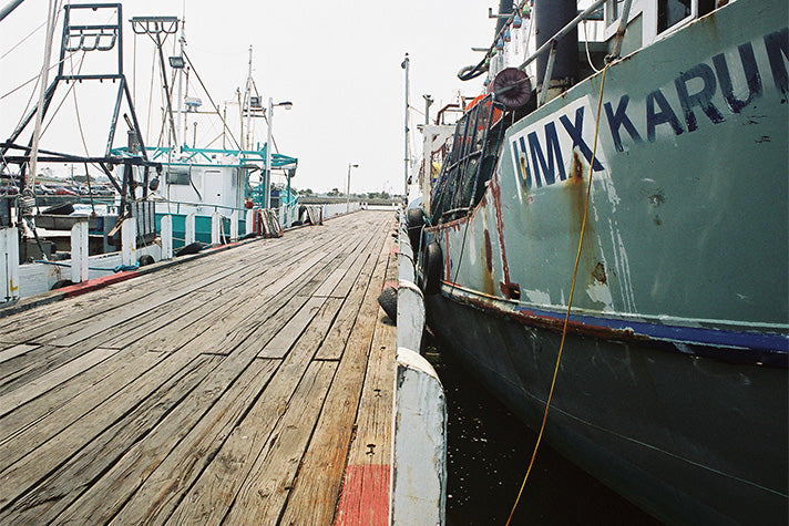 fishing boats alongside in a harbour