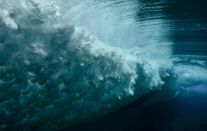 The power of a rolling wave as seen from under water