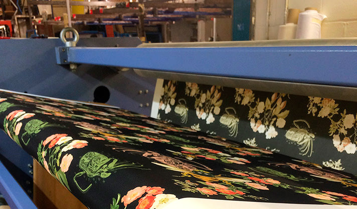 recycled polyester fabric being digitally printed with riz boardshort's endangered bee print at r a smart textile printers in macclesfield, uk