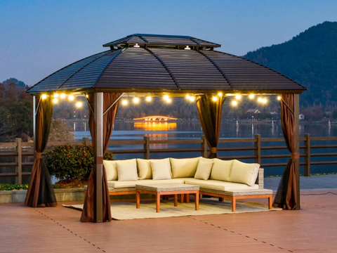 A contemporary gazebo with metal roof at dusk
