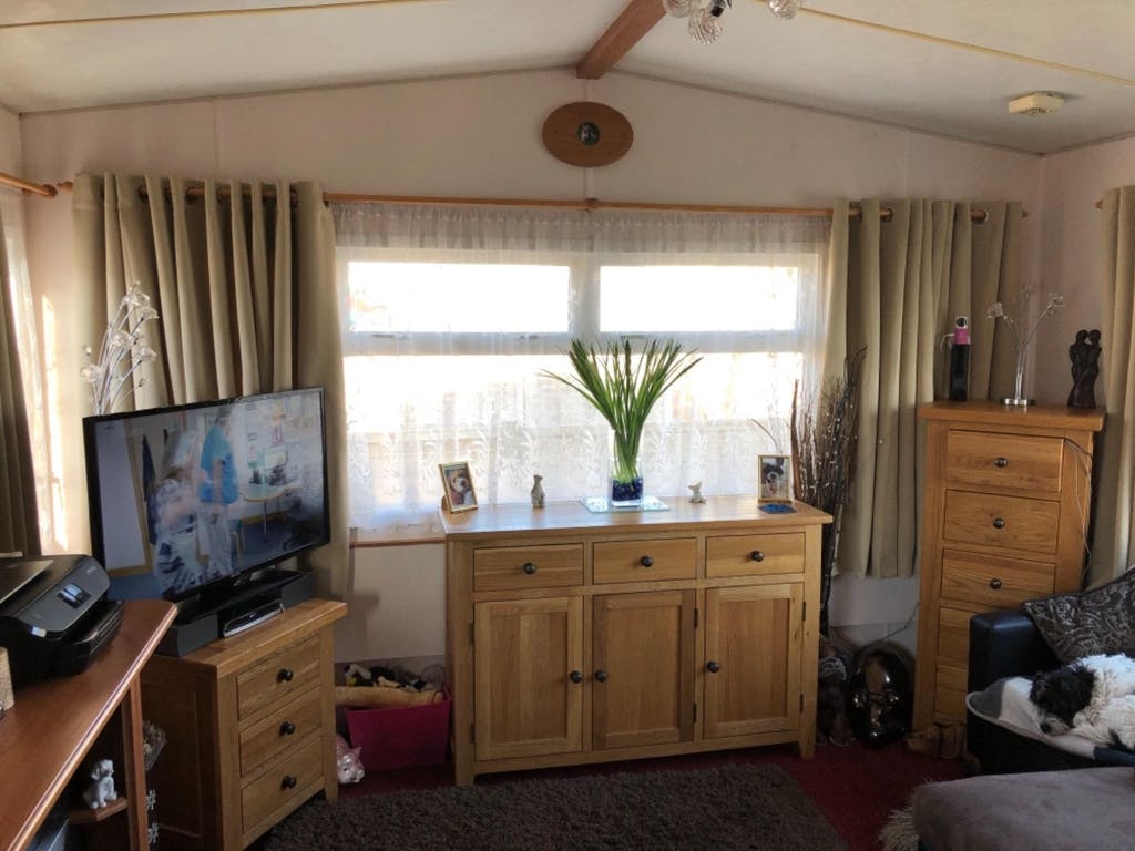 image of beige curtains in a living room