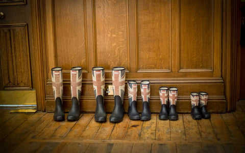 Uk Wellington Boots lined up in a hallway