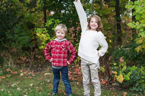 Two young boys outside in a garden 