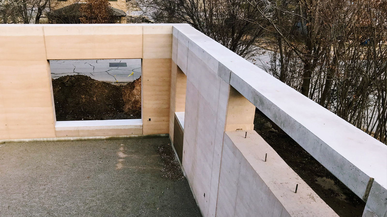 Photo of bond beam on rammed earth structure