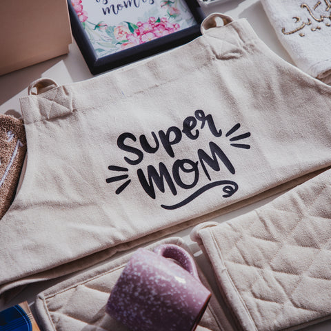 Collection of gifts with a "Super Mom" cloth bag being the focus