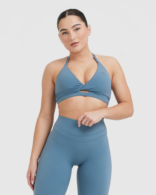 https://cdn.shopify.com/s/files/1/0427/4814/9916/products/UNIFIED_TWIST_SPORTS_BRA_MOONSTONE_BLUE_01_500x.jpg?v=1709111351