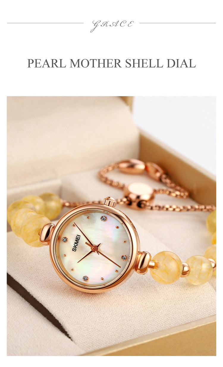 SKMEI 1983 Reloj de pulsera con pulsera de perlas para mujer con caja ultrafina de 8 mm