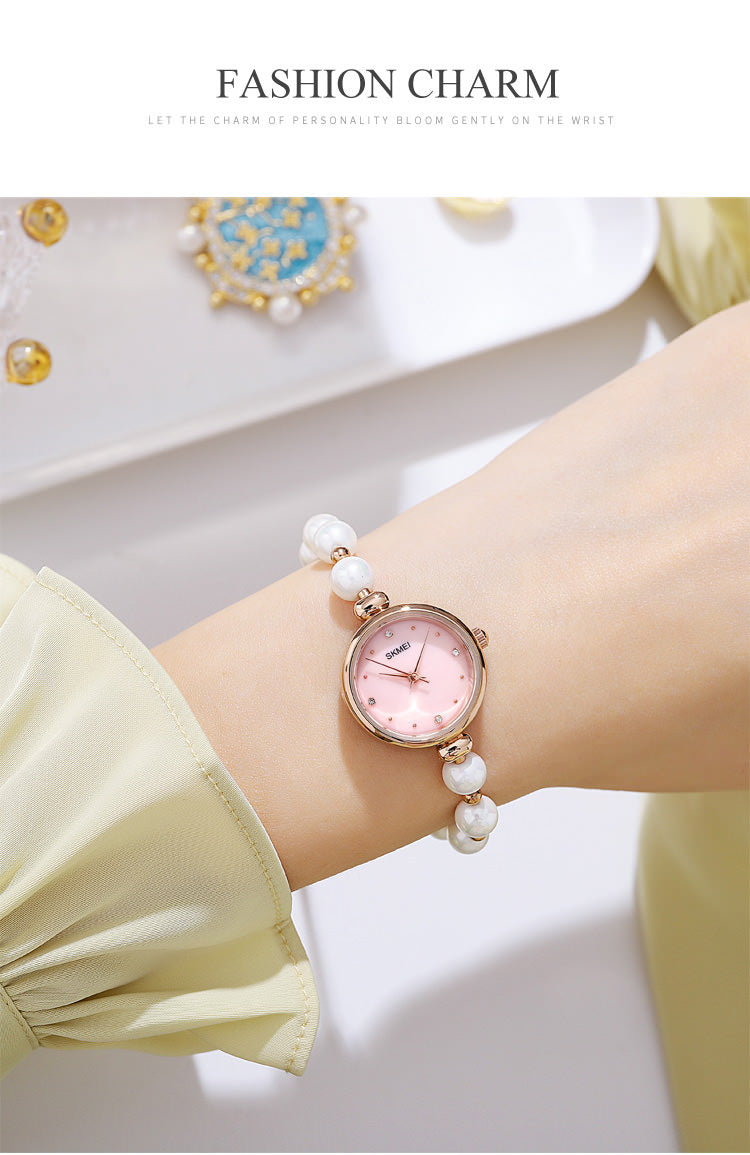SKMEI 1983 Reloj de pulsera con pulsera de perlas para mujer con caja ultrafina de 8 mm