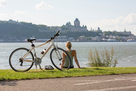 A Young Woman with Bike outside with quebec vie