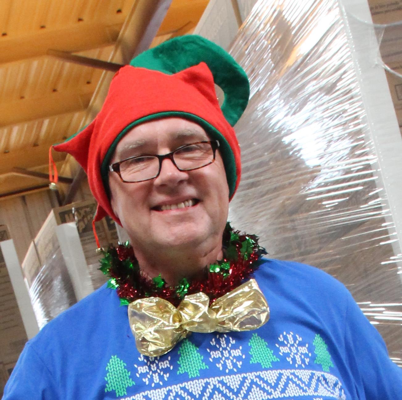 Sales representative John Riley shows off his holiday spirit with a sweater, bow tie and hat. 