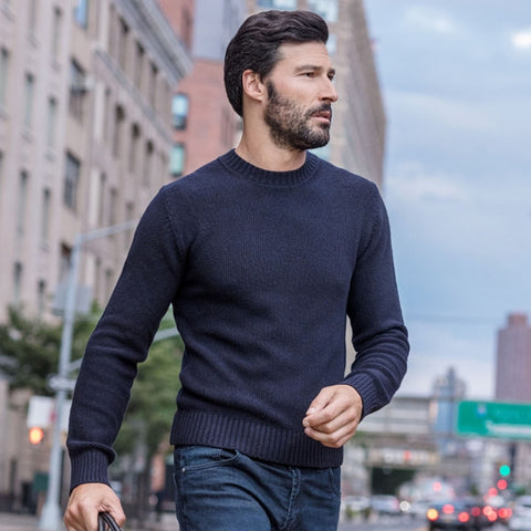 Man walking in navy blue sweater