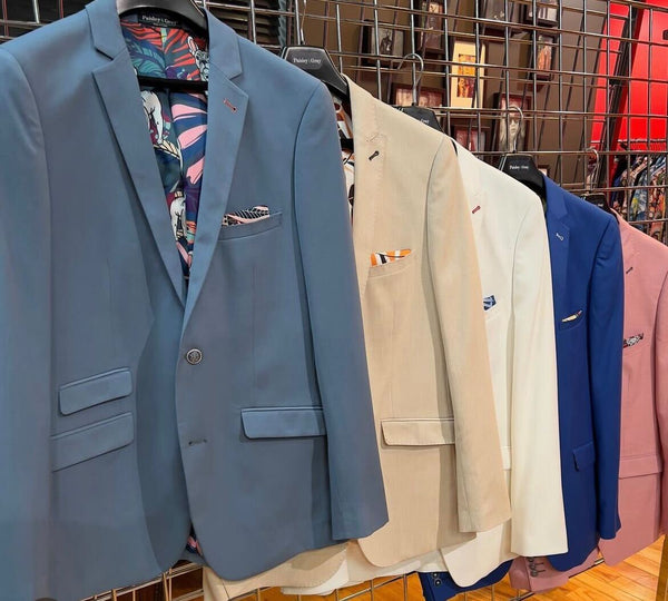 Multi Colored blazers hanging on a rack