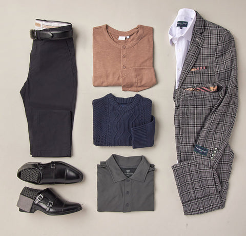Flat lay of a gray plaid suit, dress pants, and dress shoes