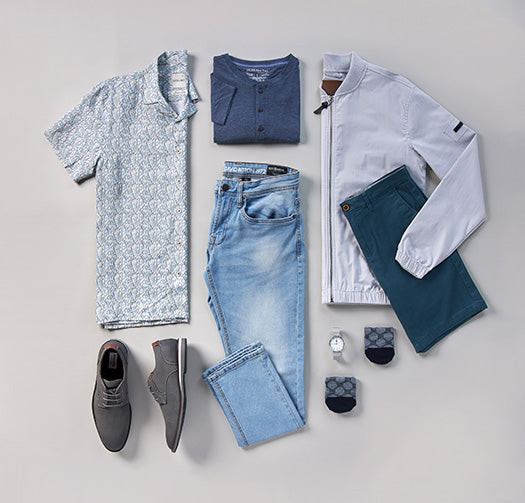 Flat Lay clothing, short sleeve patterned  button down, henley tee, jacket, shorts, light  denim, watch, socks, and dress shoes.