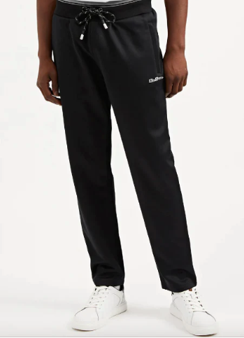 Black sweatpants are worn with white sneakers on a white background.