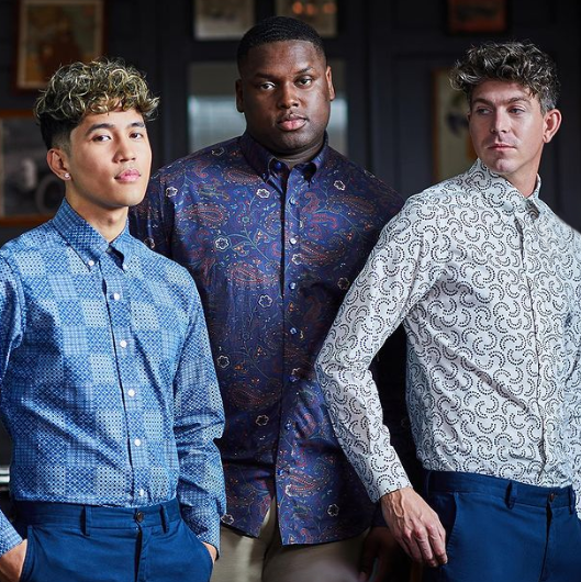 3 men wearing different geometric patterned button-downs