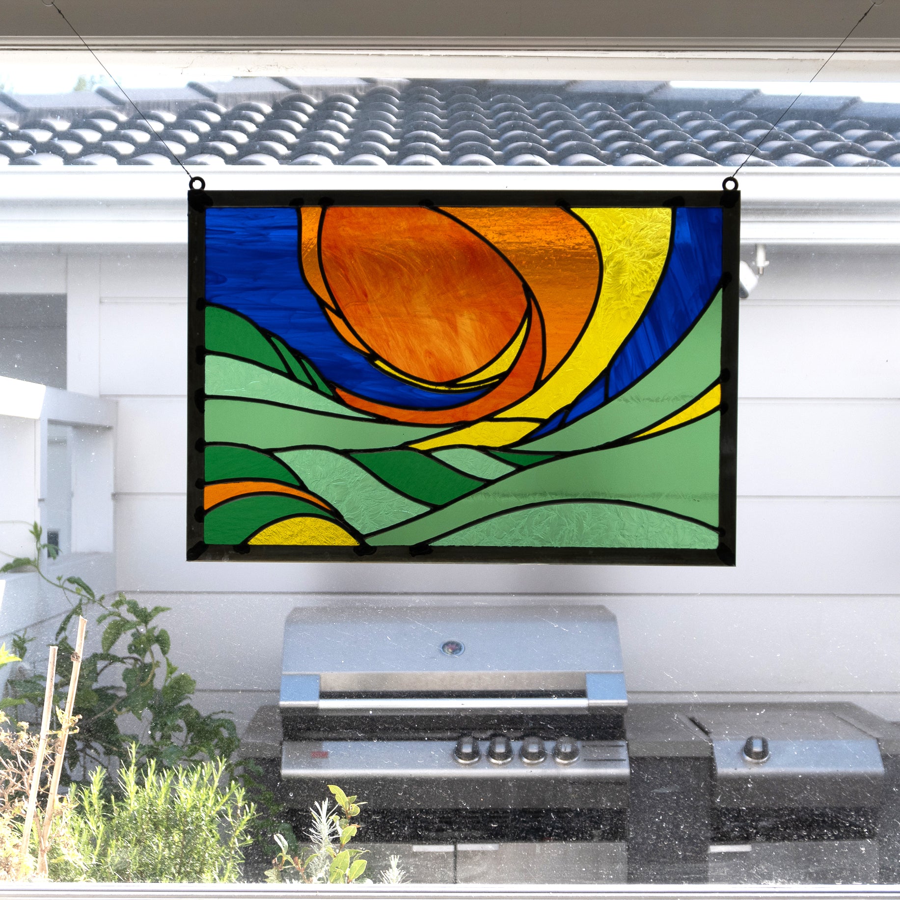 Raising sun, stained glass panel installed