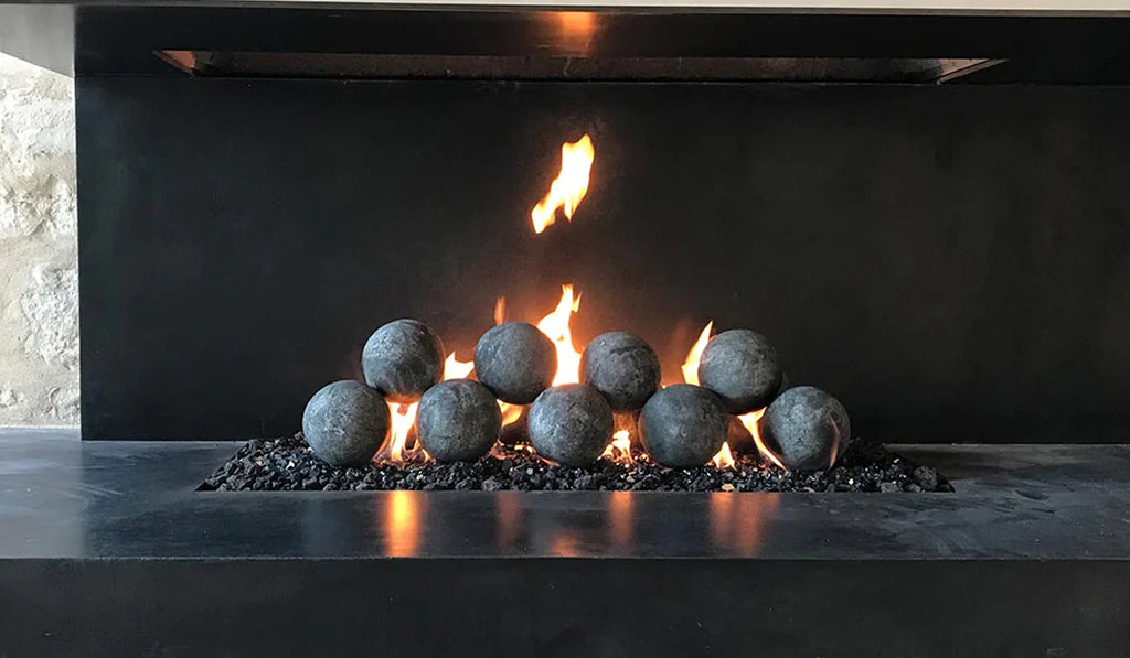 Gas fireplace with black fireballs instead of logs with a black hearth.
