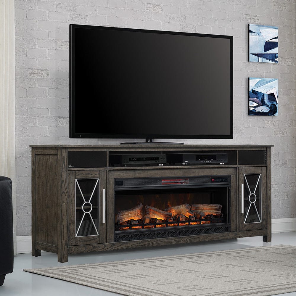 Rustic tv console electric fireplace unit with metal accents and tv on top.