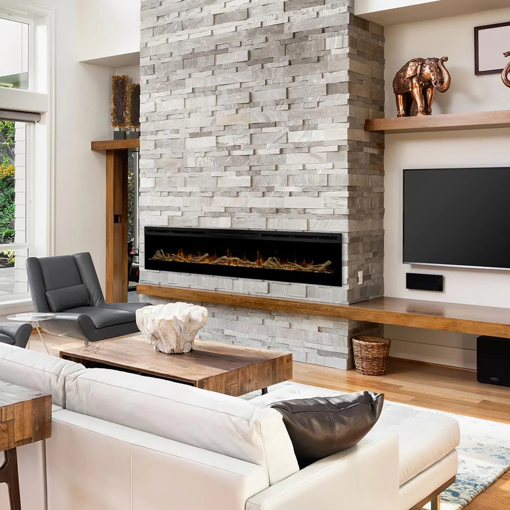 Large linear electric fireplace in a stacked stone surround that goes all the way to the ceiling.