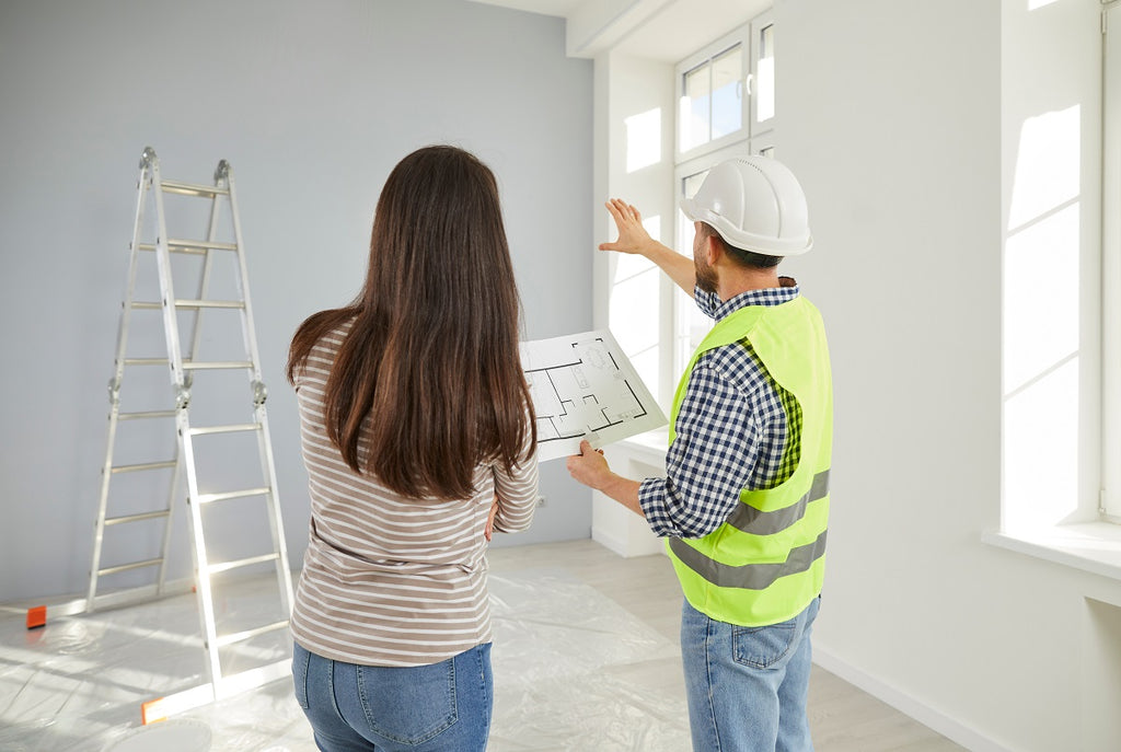 Contractor working with a homeowner on a home design.