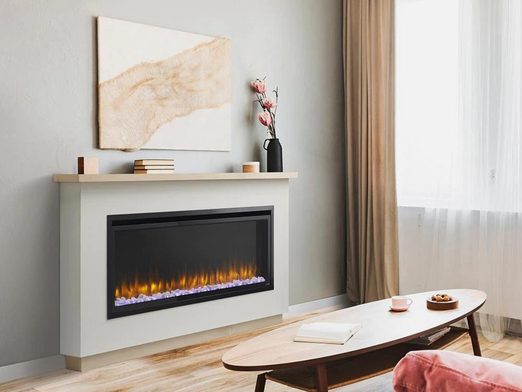 Electric fireplace in a wall with art above the mantel.