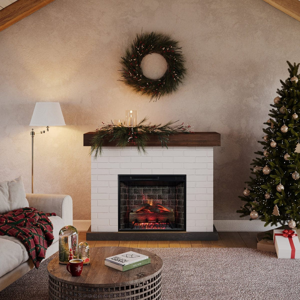 White brick fireplace surround with dark wood mantel with an electric fireplace insert in a cozy living room decorated for the holidays.