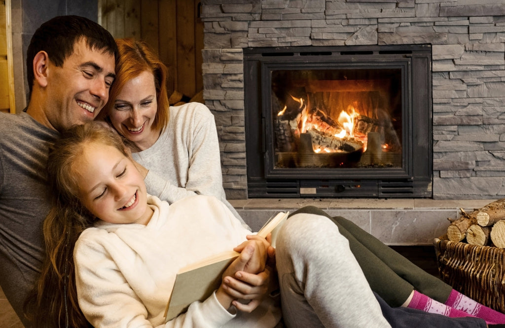 Family in front of a fireplace.