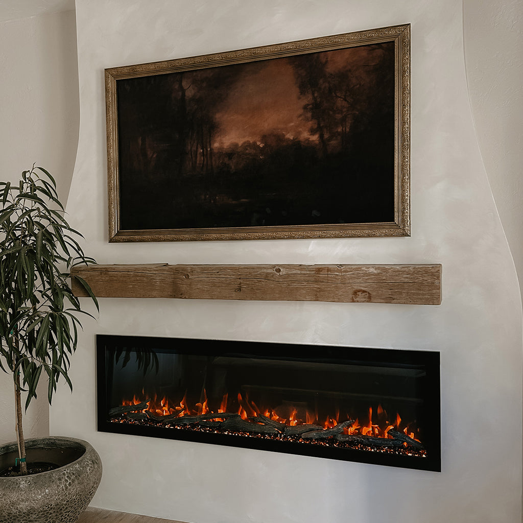 Fireplace and mantel with small tree next to it to add some greenery.