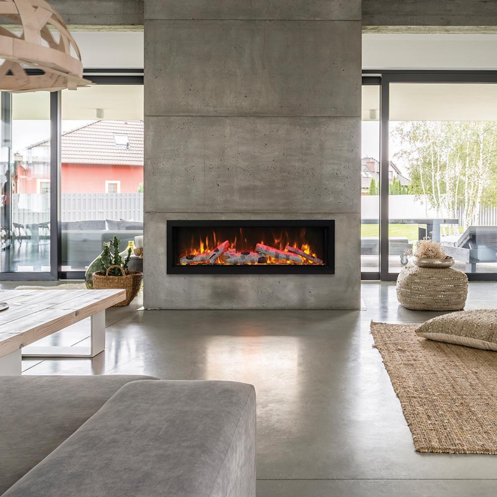 Large living space with linear fireplace built in to a concrete column.