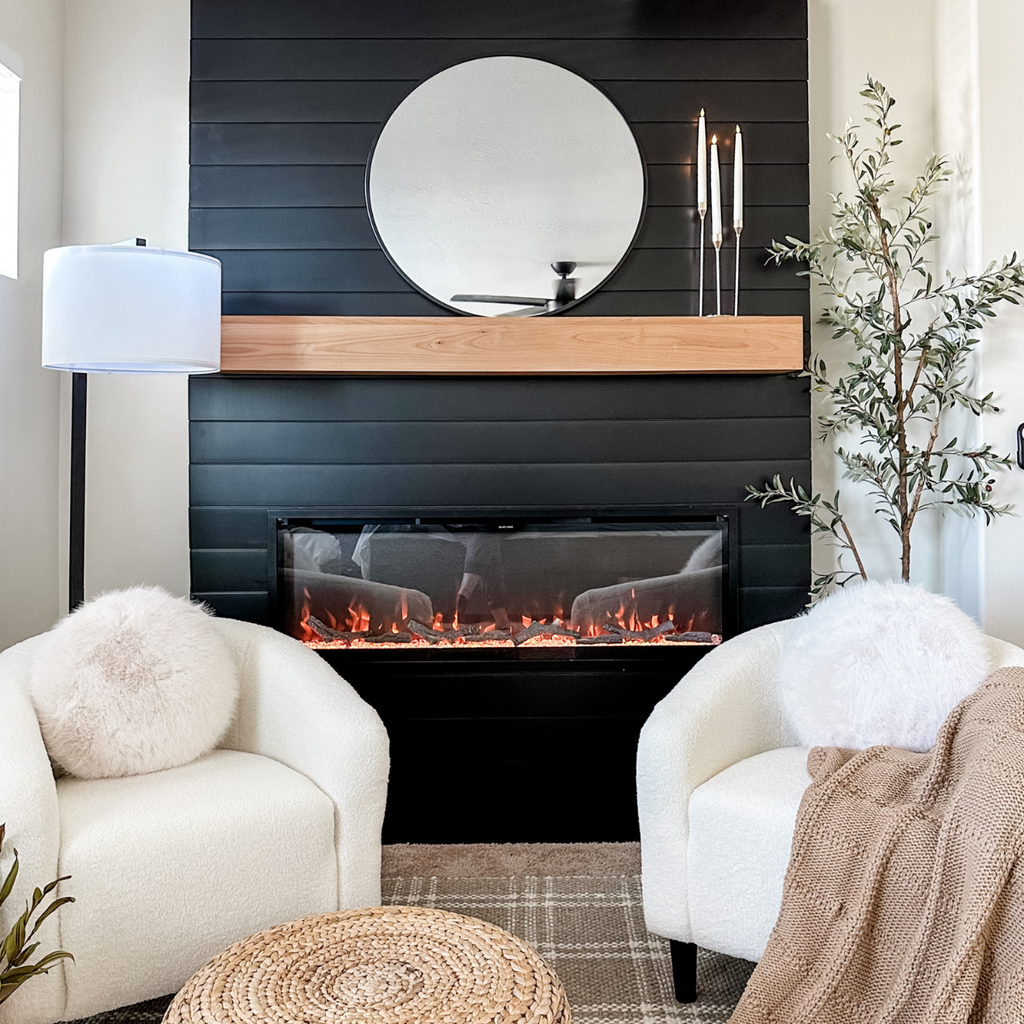 Cozy living space with built-in linear electric fireplace in a black paneled bump out.