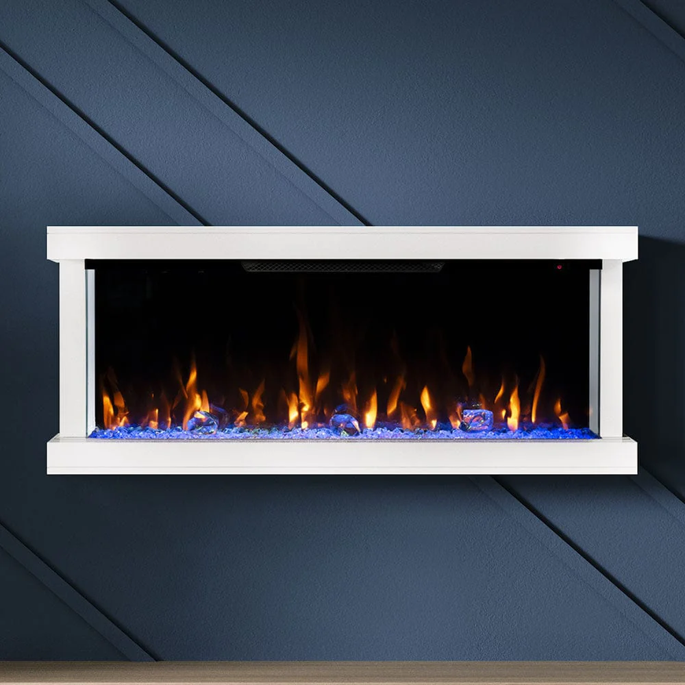 White framed electric fireplace against a blue wall with wood floor.