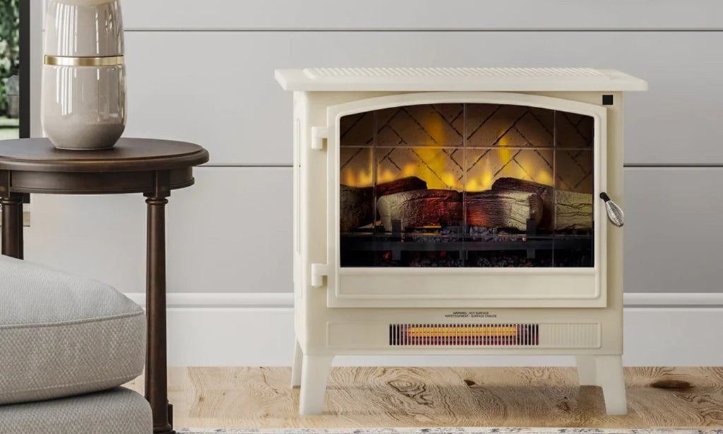 Freestanding electric stove style fireplace in white in a cozy living room.