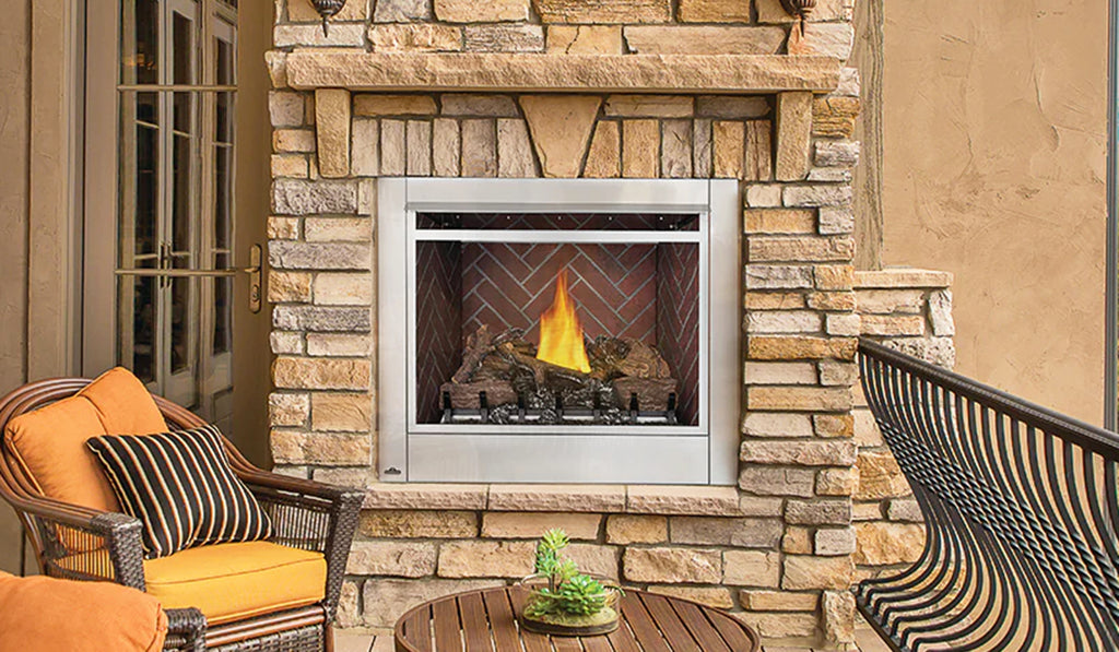 Gas fireplace with silver metal trim in a stacked stone surround.