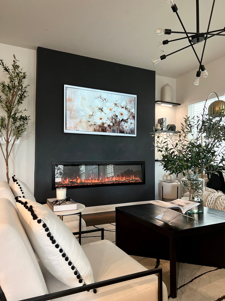 Linear fireplace in a large lobby with modern cozy decor.