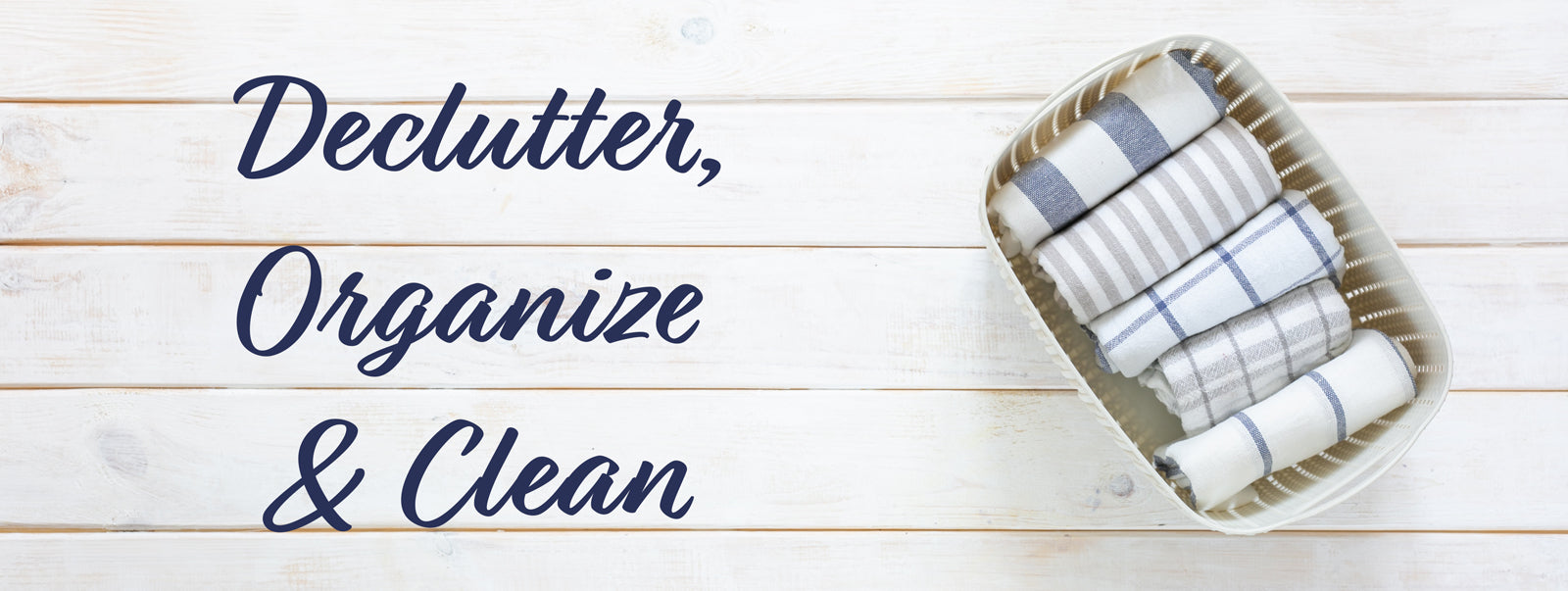 Declutter, Organize and Clean next to a basket of folded sheets.