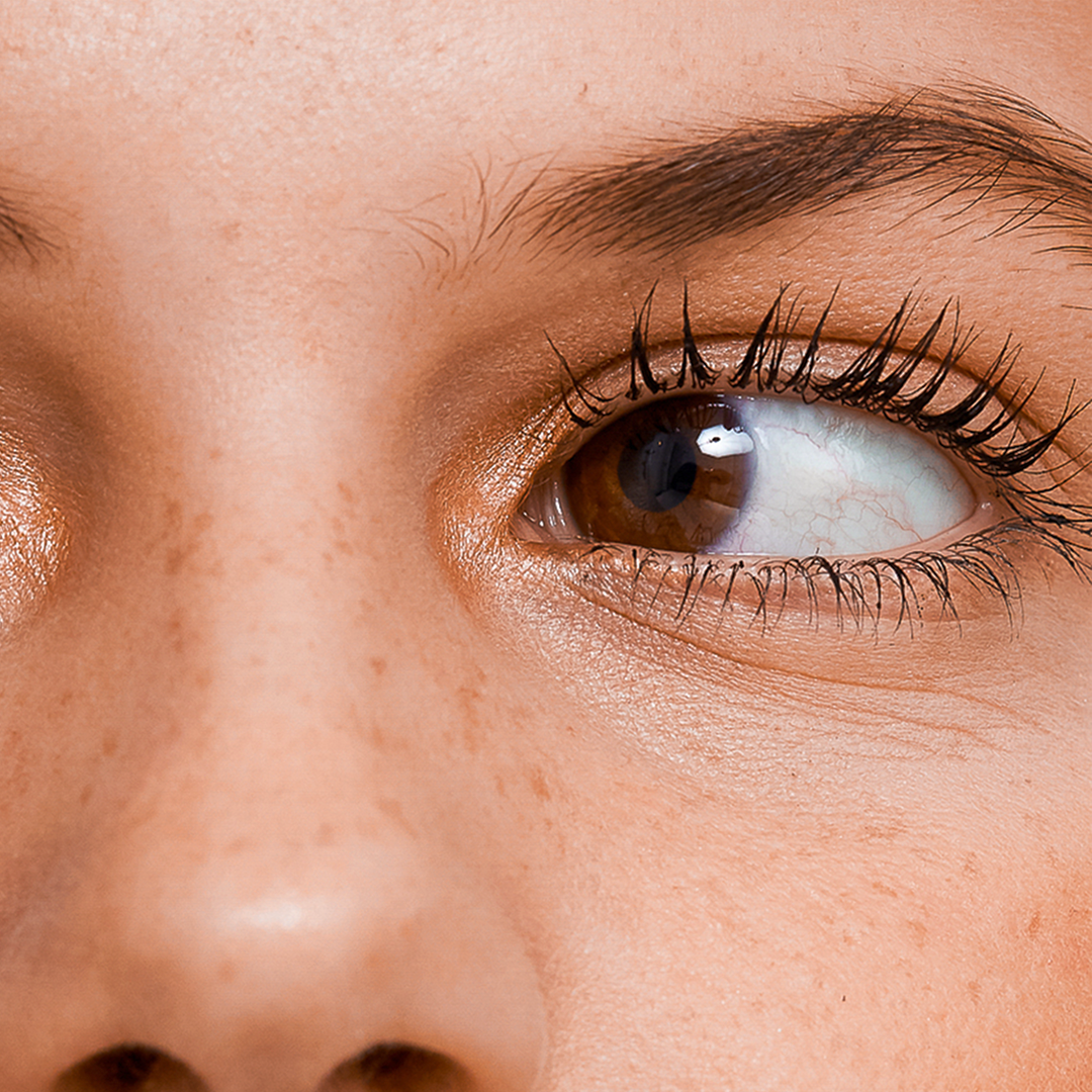 Close up of a woman's eye with long lifted lashes