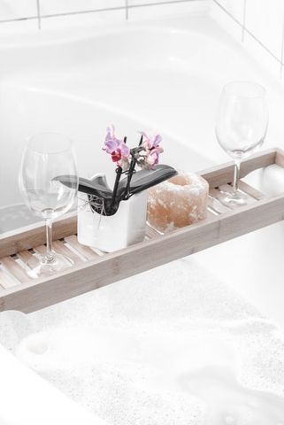 two wine glasses on tray with pink rose quartz, at home spa