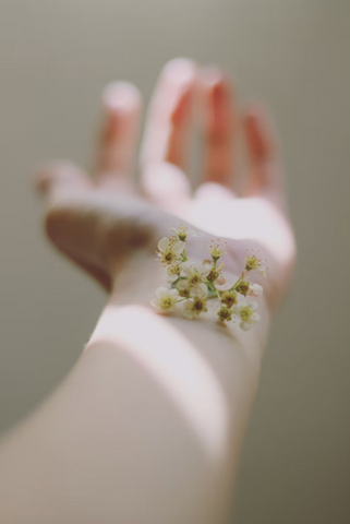 hand with flower on wrist