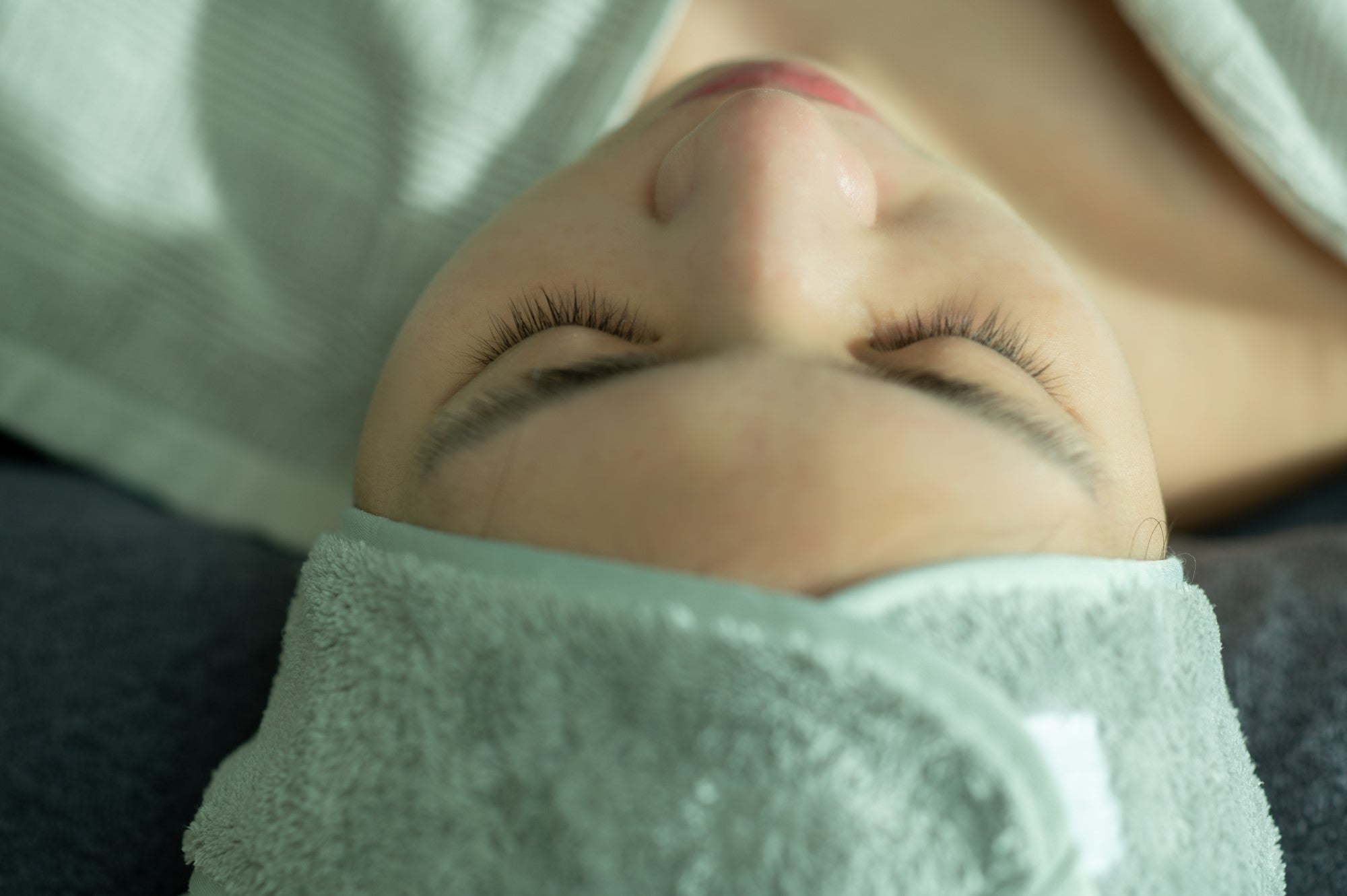 woman lying down for a facial