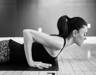 yoga instructor Carmelinda Dimanno in cobra pose