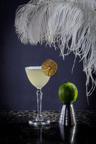Margarita cocktail served with Silver Tongue Foods dried lime slice as a garnish. 