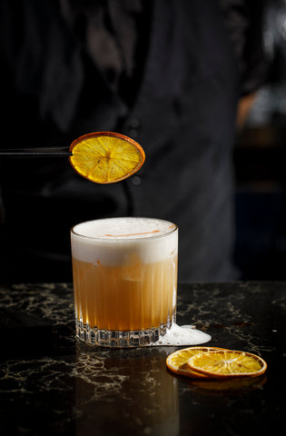 Amaretto Sour with Silver Tongue Foods dried orange 