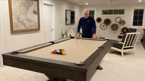 Customer looks down at his new Isabella Manhattan in Brownwash already set up for game of eight-ball.