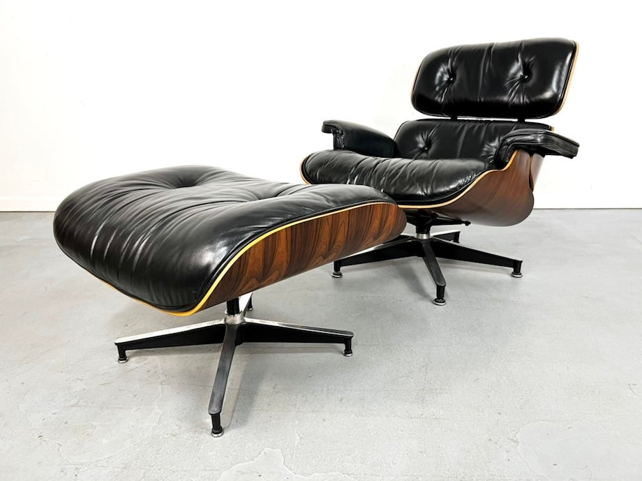 An authentic Eames Lounge Chair and Ottoman by Herman Miller constructed of plywood frame covered with rosewood veneer.