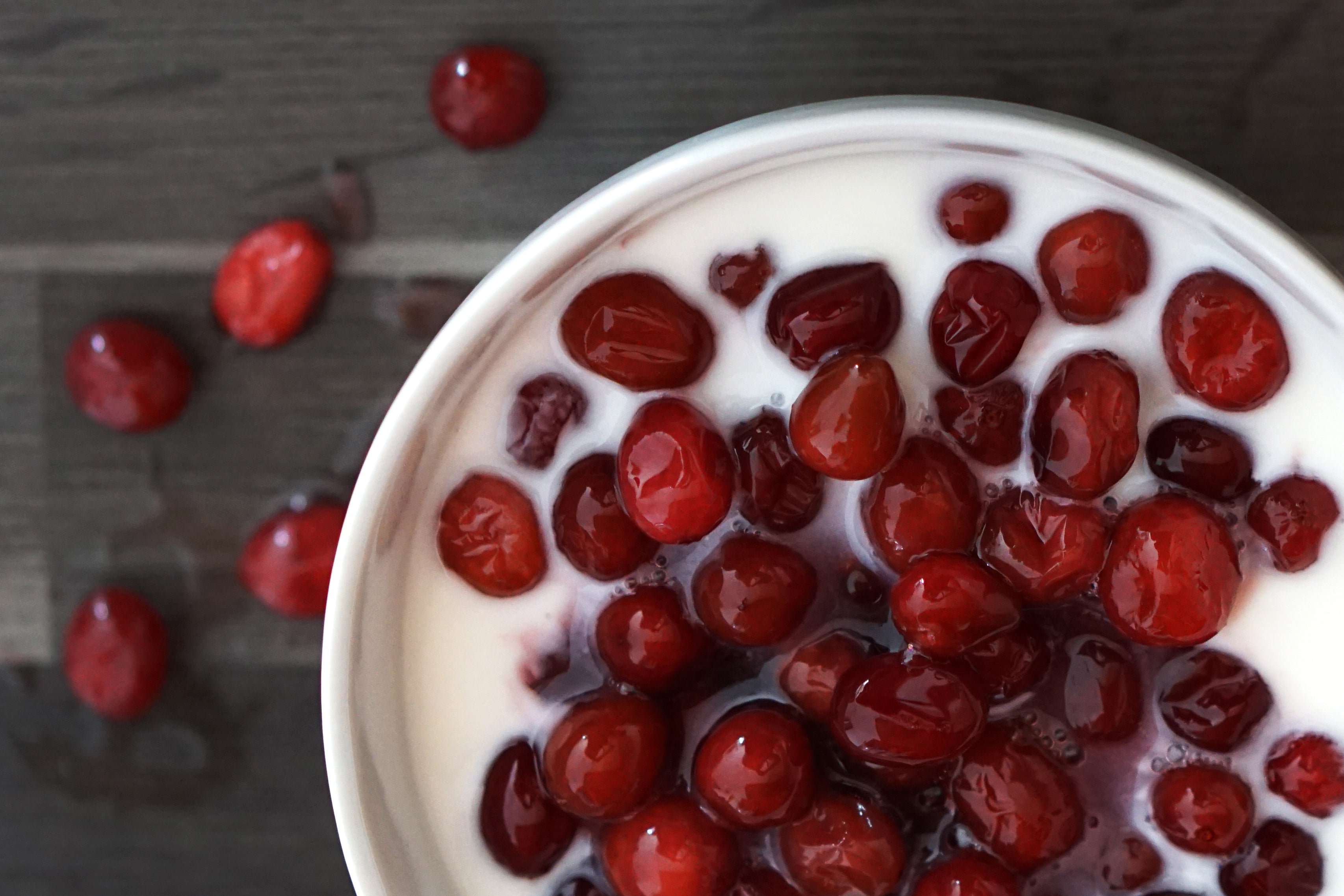 Boiled cranberries with almond milk and cinnamon vanilla oats.