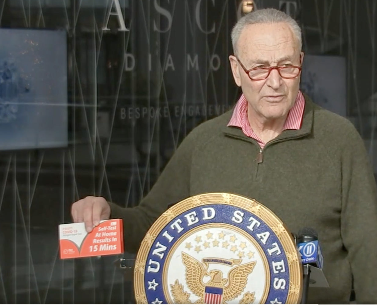 Senator Schumer holding iHealth Covid Test Kit