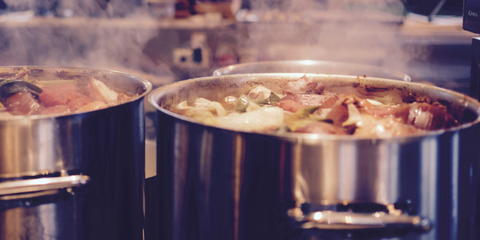 Irish stew ingredients boiling in a large pan