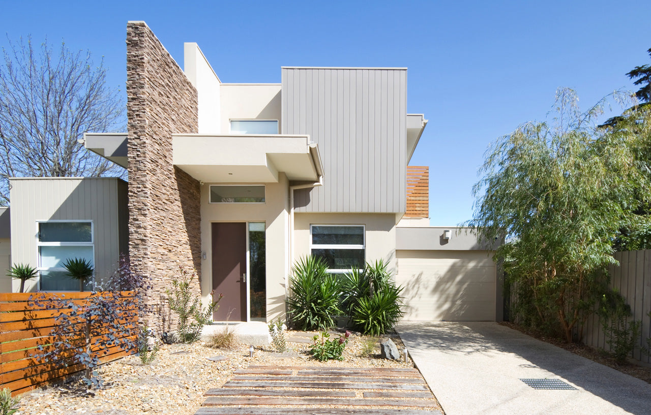 modern home with beautiful landscaping